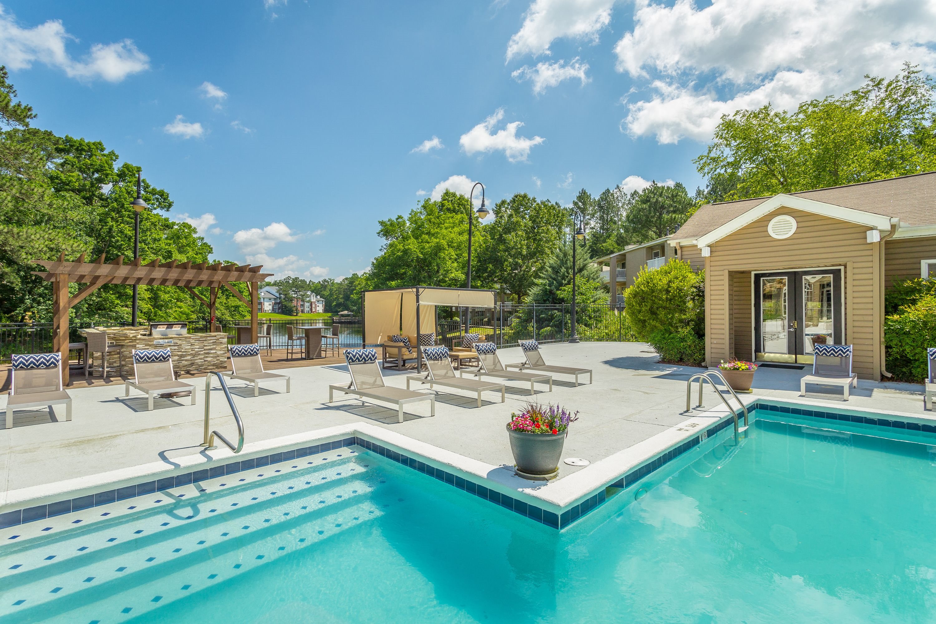 Sparkling swimming pool and spacious sundeck at The Avenues of Inverness  in Birmingham, AL